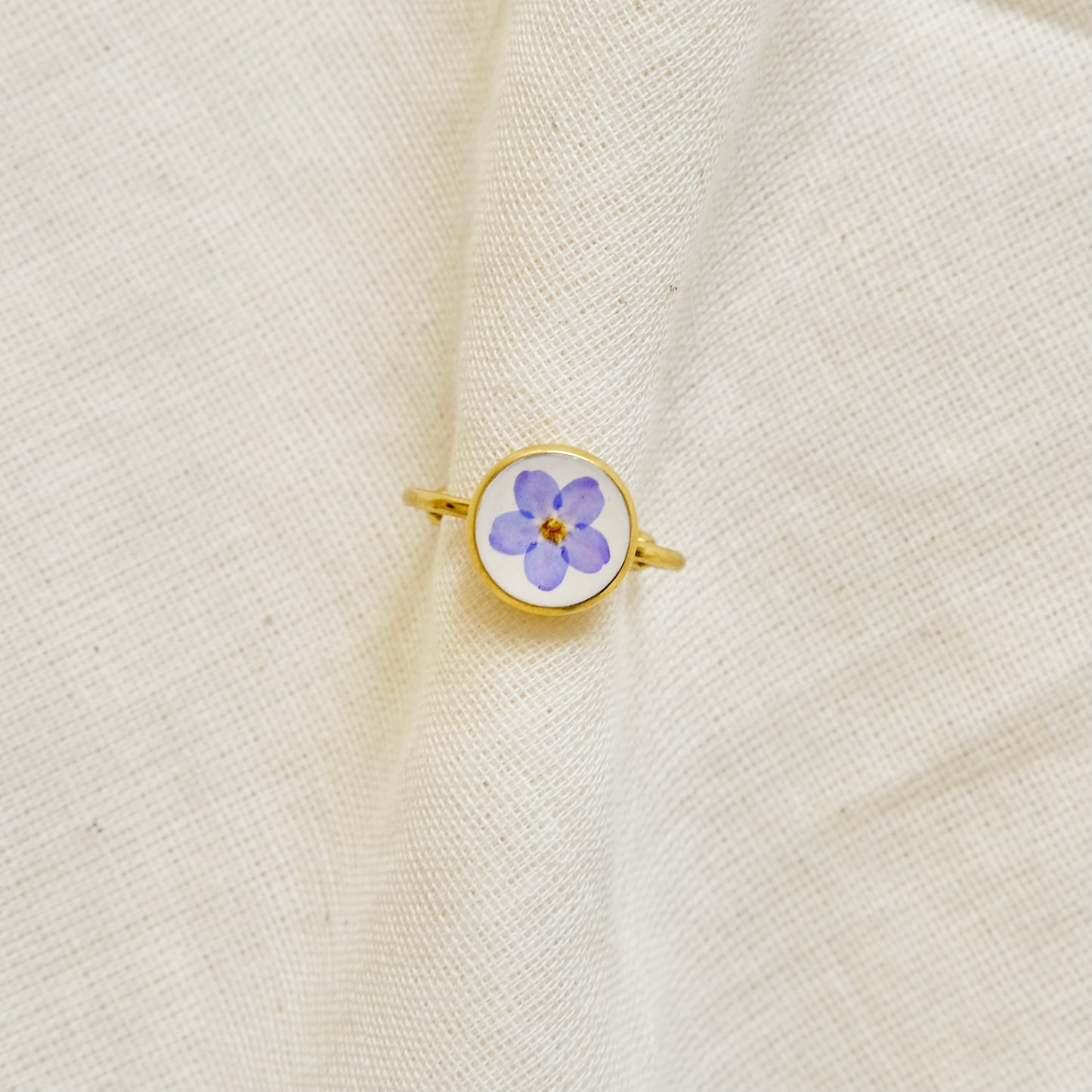 gold ring with pressed flower
