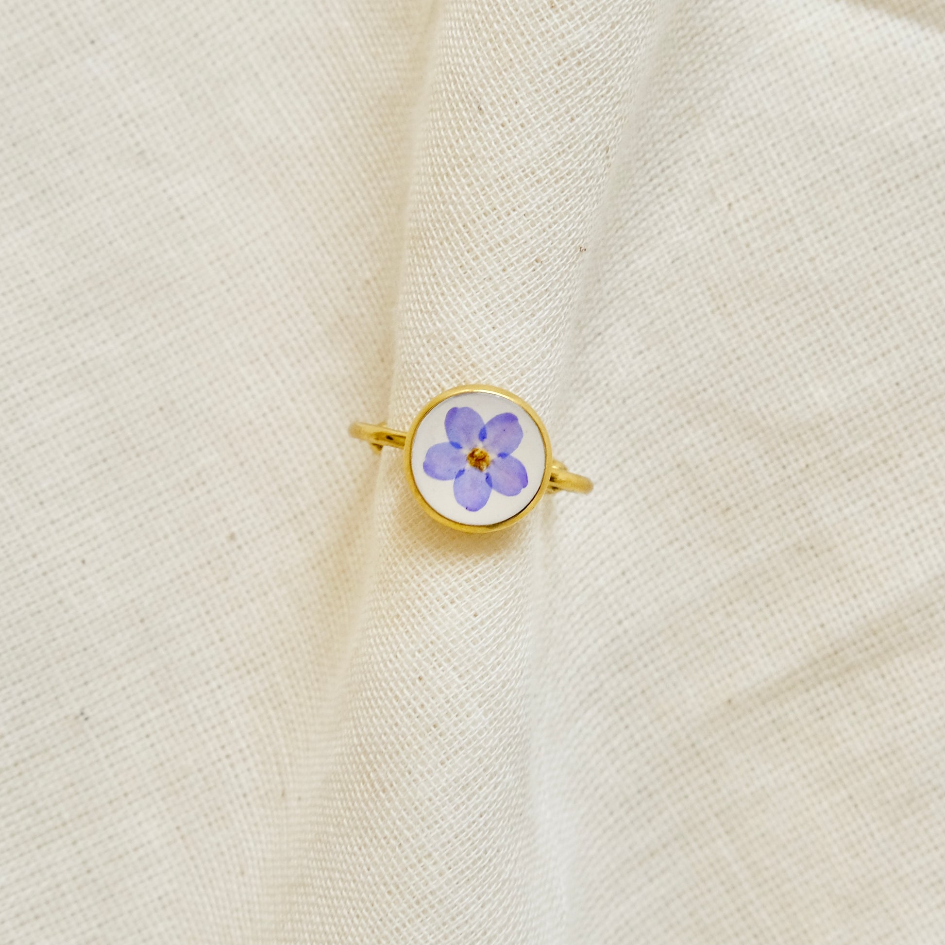 gold ring with pressed flower