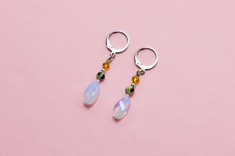 hypoallergenic huggie earrings with gemstones