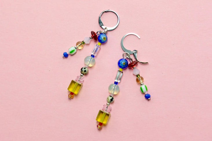 Beaded earrings on a pink background